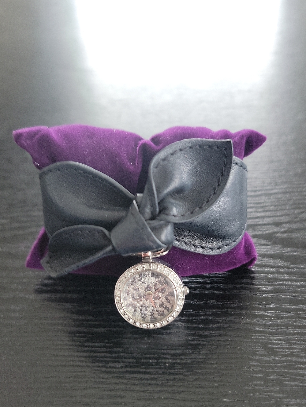 Guess Black Leather Bow and Crystal Charm Watch.